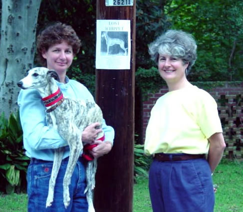 Kay and Kathy with Poetry in front of "lost whippet" poster